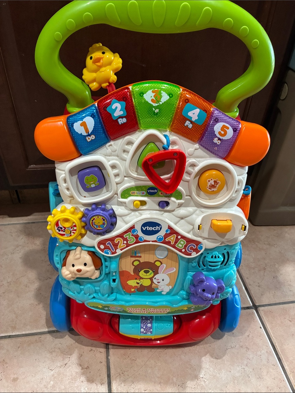 VTech Multi-Activity Learning Walker ā Green Handle with Blue & Red Base